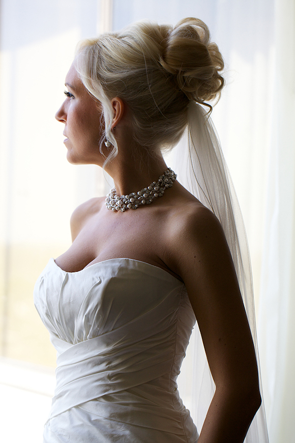 bride looks out window - wedding photo by top Philadelphia based wedding photographers Langdon Photography